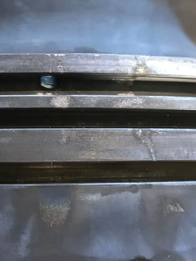 Heavily coked diesel piston before ultrasonic cleaning
