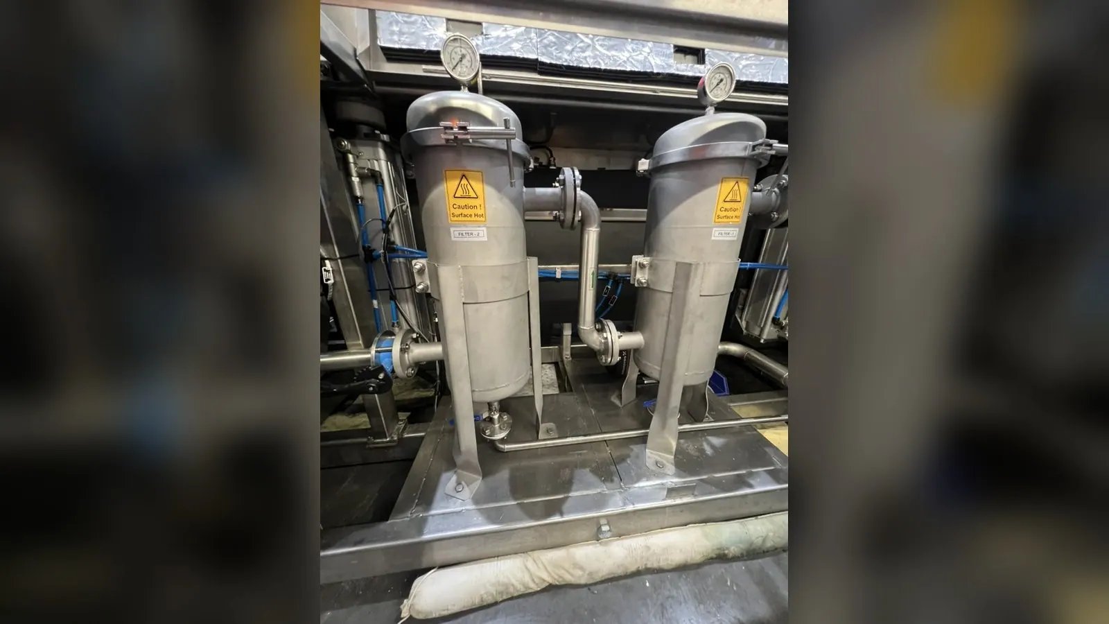 Industrial ultrasonic tank with weir and filtration skid