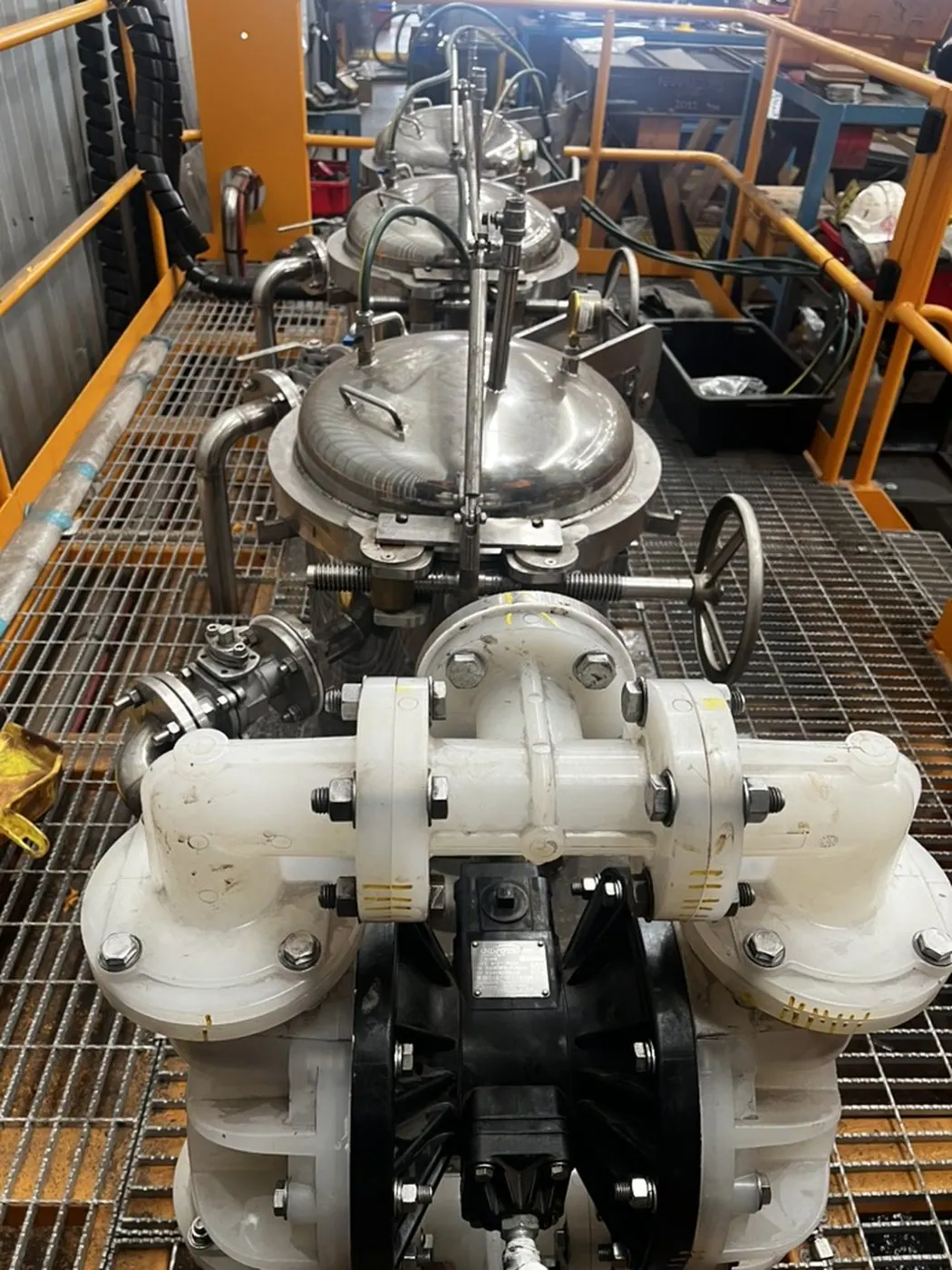 Diaphragm pump feeding the filter housings, isolation valve behind