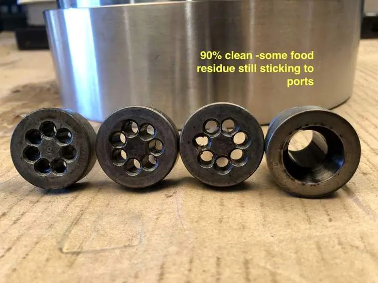 Row of dies labelled ninety percent clean with some residue still in ports