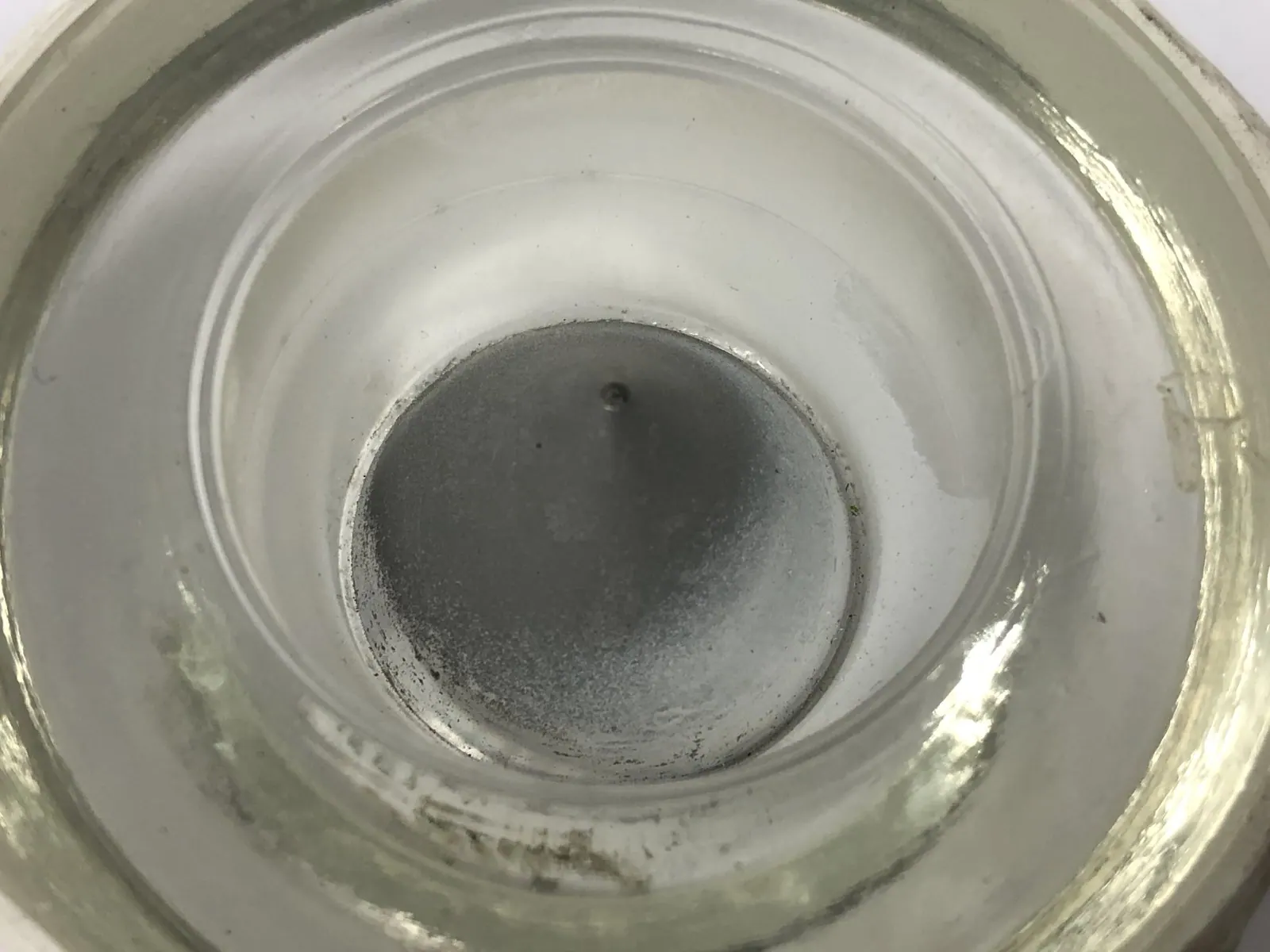 Airfield light lens centre optic before and after ultrasonic cleaning — as received