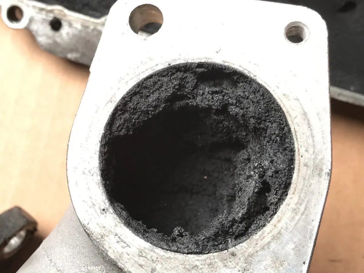 Inlet port bore — before and after ultrasonic cleaning — as received