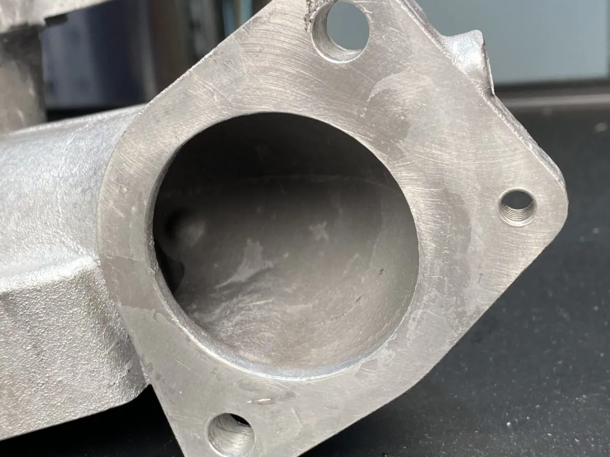 Manifold flange port — before and after ultrasonic cleaning — after the cycle