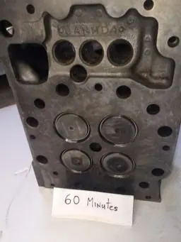 Cat 3516 cylinder head combustion face before and after ultrasonic cleaning &mdash; after the cycle