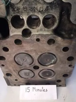 Cat 3516 cylinder head combustion face before and after ultrasonic cleaning &mdash; as received