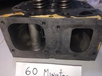 Cat 3516 cylinder head ports before and after ultrasonic cleaning — after the cycle