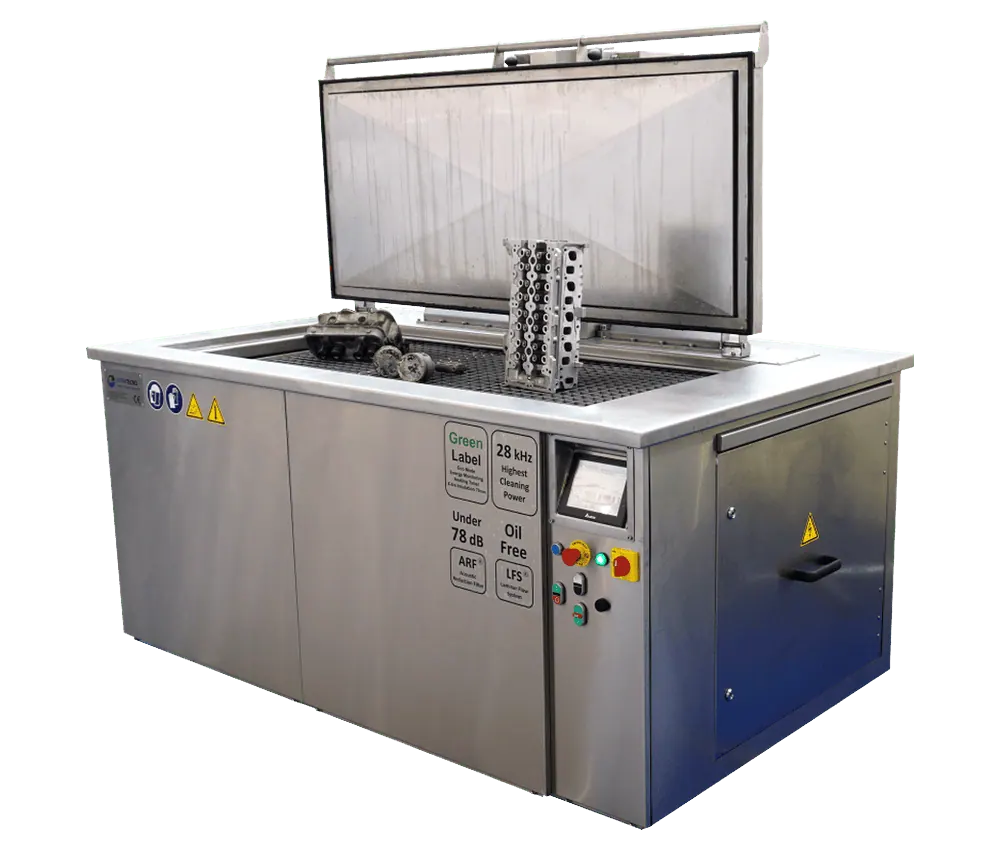 UltraTecno ACM-750N ultrasonic cleaning machine with the insulated lid open and a cylinder block standing on the platform lift